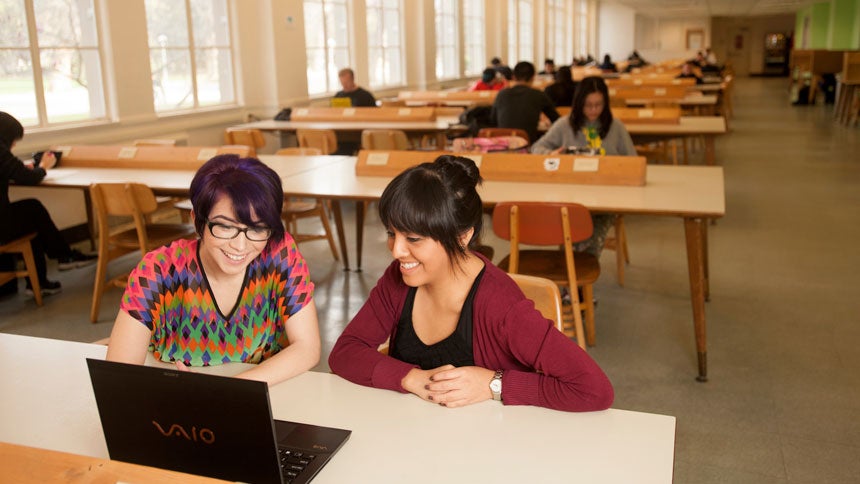 two students study in the ֱ Shield's Library 24 hour study room