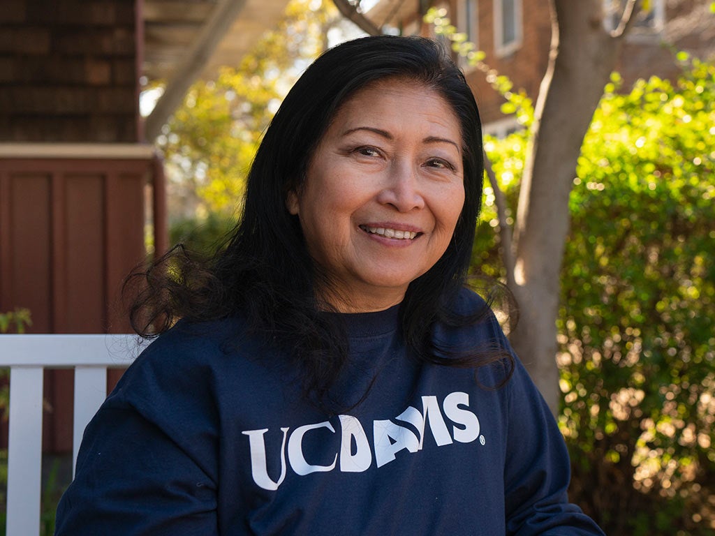 A photo of Mary-Ann Meyers smiling on a bench on the ֱ campus