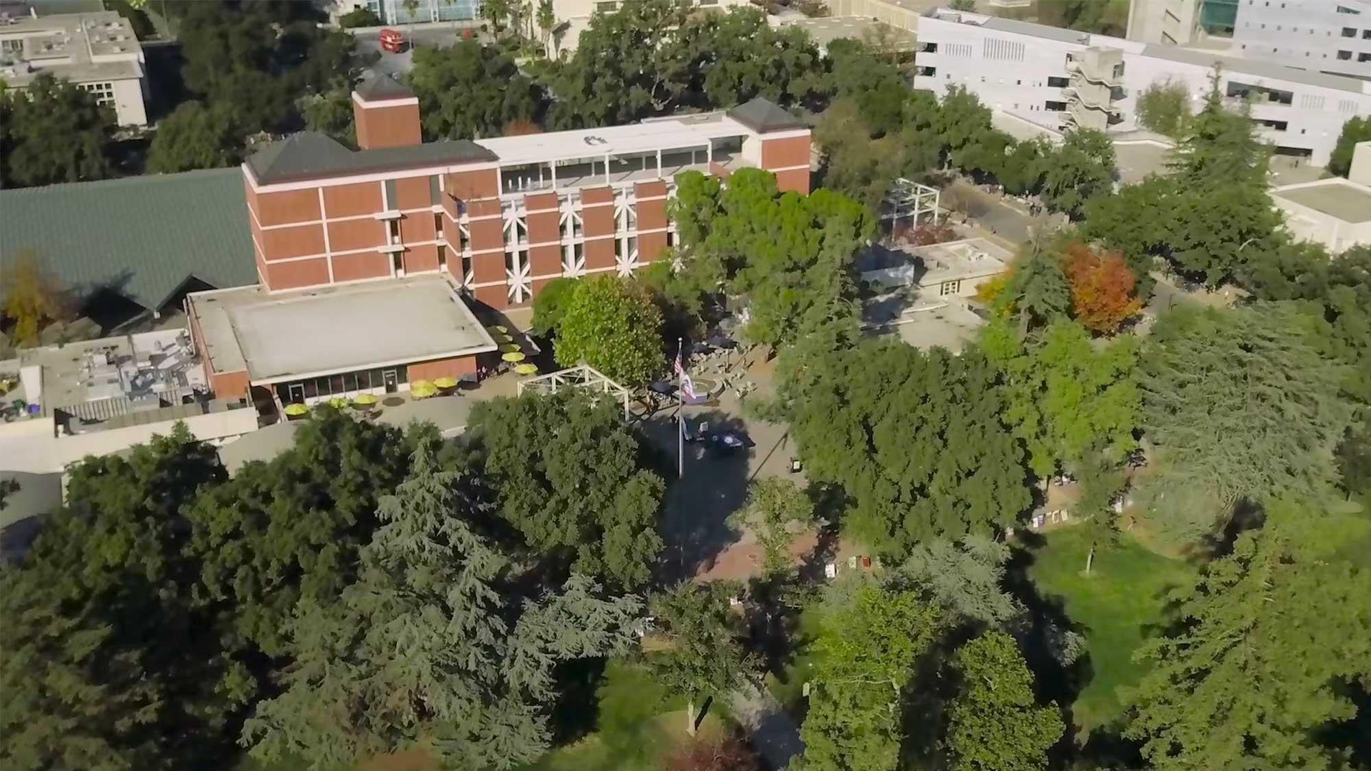 aerial view of the ֱ campus showing some buildings surrounded by trees