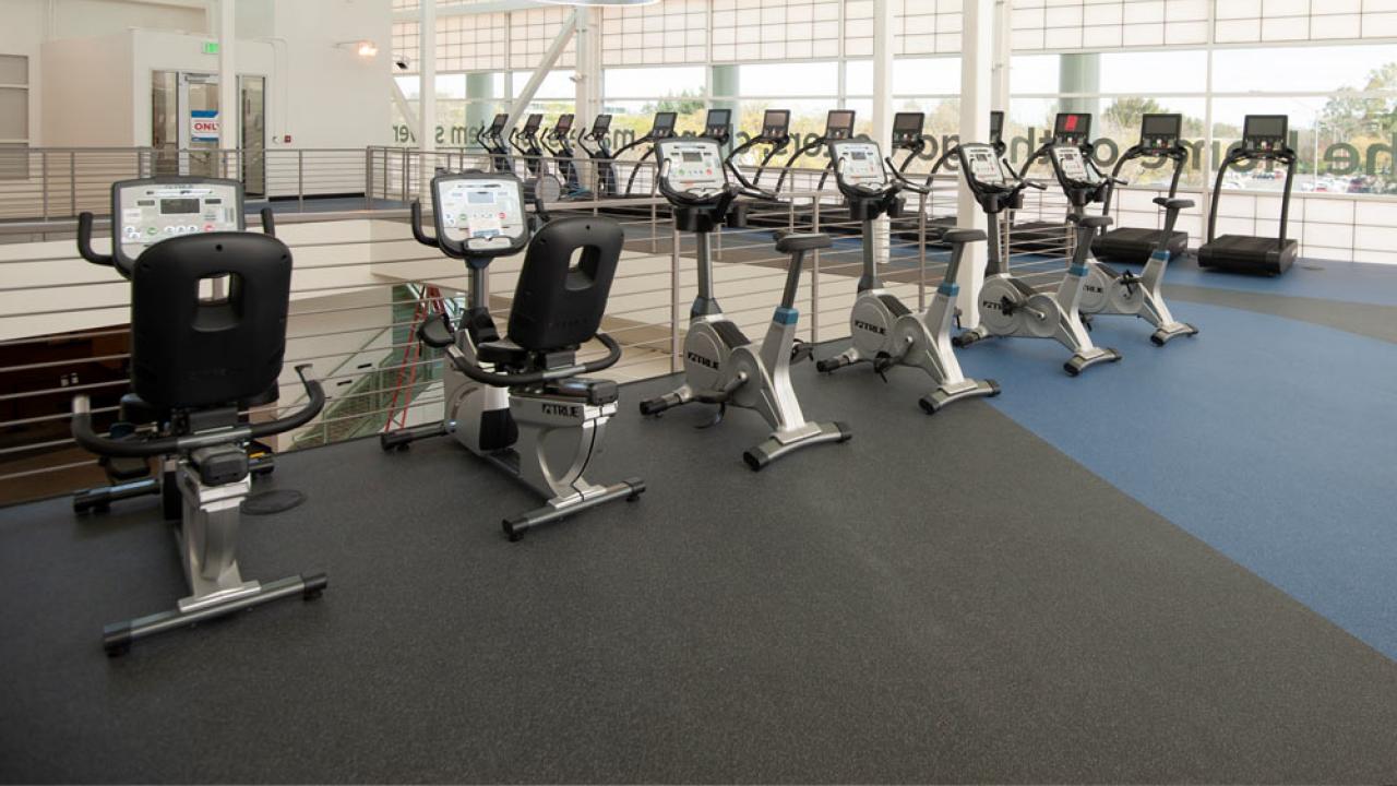 A row of exercise machines on the upper level of the ֱ Activities and Recreation Center
