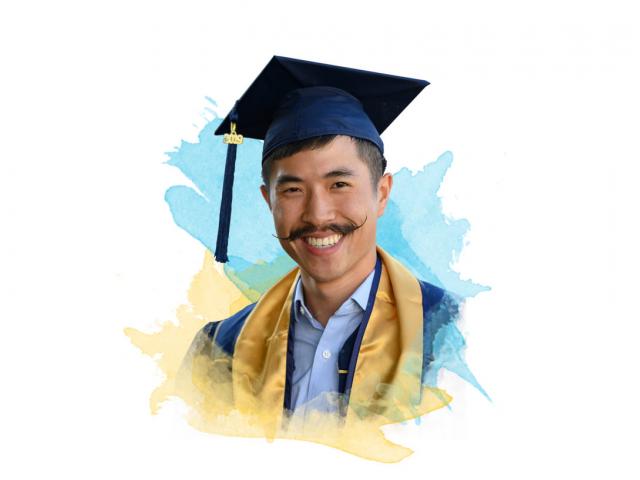 A smiling ֱ graduate with an amazing mustache