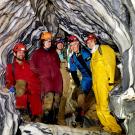 Five ֱ researchers inside marble rock formations of cave
